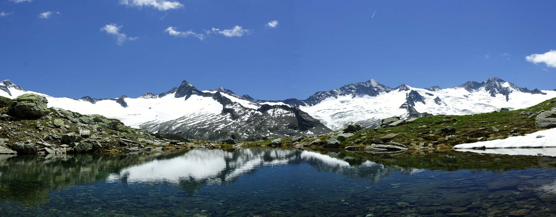 crystal clear Mountain Lakes at the Foot of glaciated Peaks